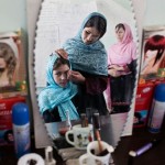 Afghan girls practice beauty care